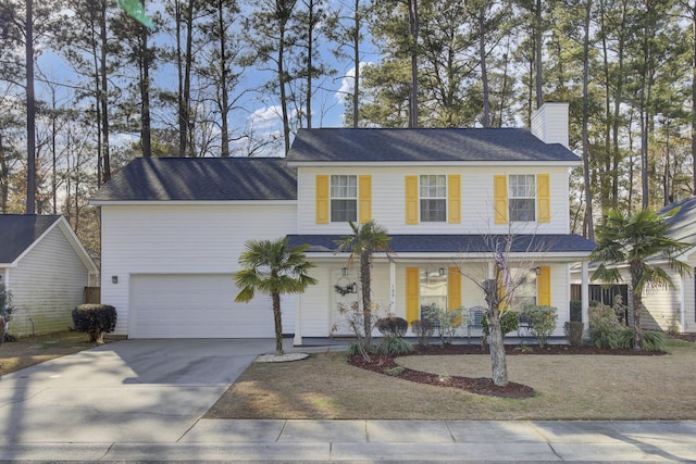 view of front of property featuring a garage and covered porch