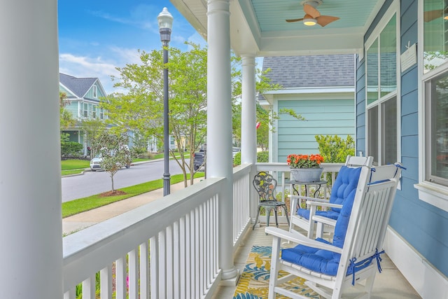 balcony featuring a porch and ceiling fan