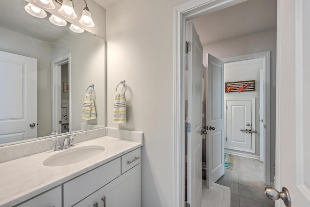 bathroom with tile patterned floors and vanity