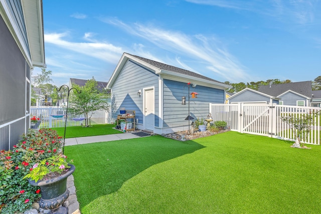 exterior space with an outdoor structure, fence, and a gate