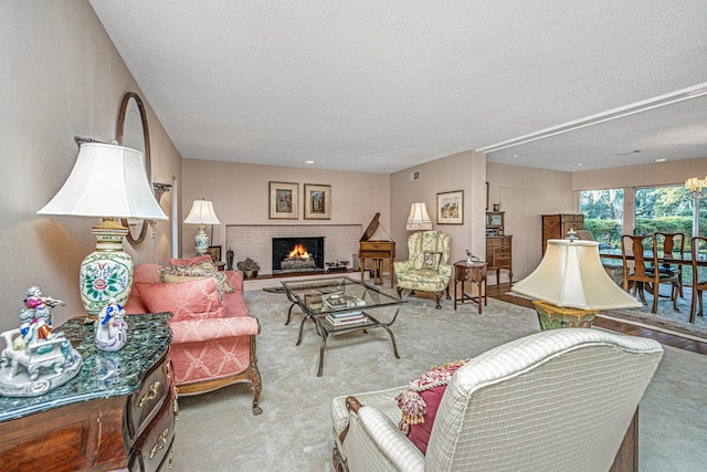 living room with light colored carpet, a textured ceiling, and a brick fireplace