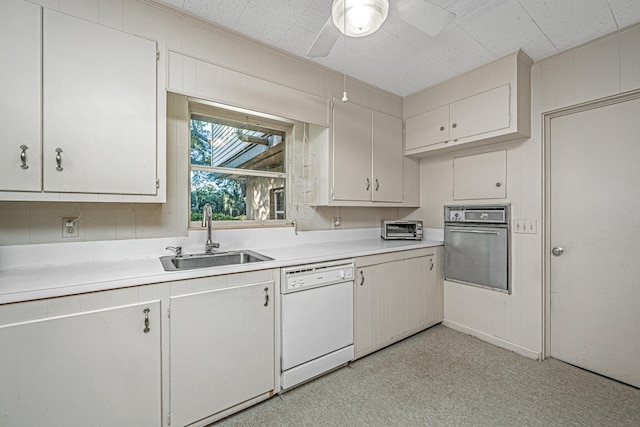 kitchen featuring stainless steel oven, white dishwasher, white cabinetry, and sink