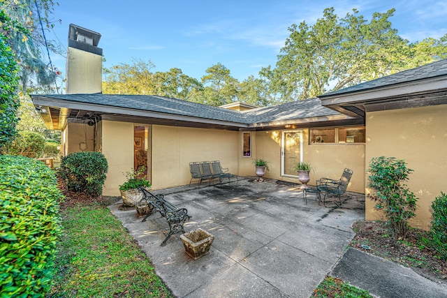 rear view of house with a patio area