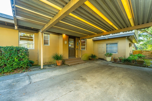 entrance to property featuring a carport