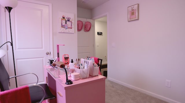 carpeted bedroom featuring baseboards