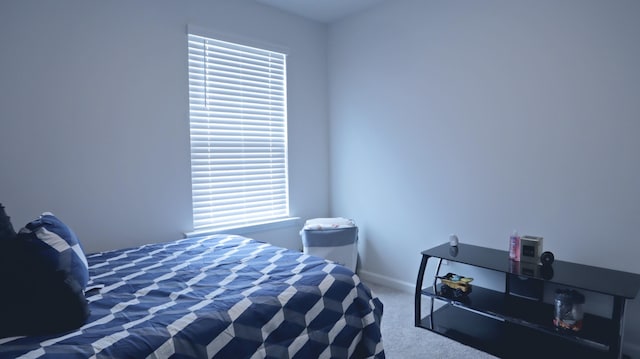carpeted bedroom with baseboards
