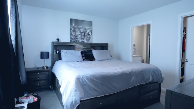 carpeted bedroom featuring ensuite bathroom