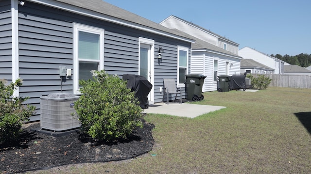 rear view of house featuring cooling unit