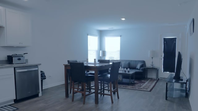dining room featuring dark wood-style floors, baseboards, and recessed lighting