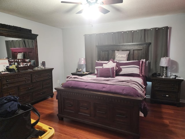 bedroom featuring wood-type flooring, a textured ceiling, and ceiling fan