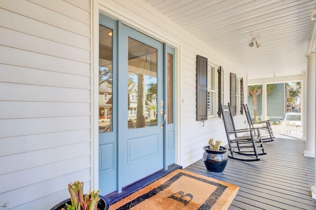 wooden terrace featuring a porch