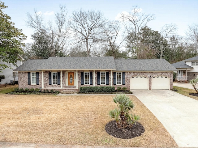 ranch-style house with a garage and a front yard