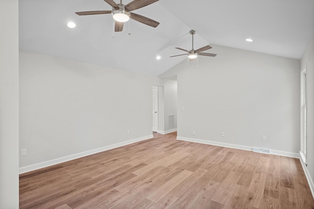 unfurnished room featuring vaulted ceiling, light hardwood / wood-style floors, and ceiling fan