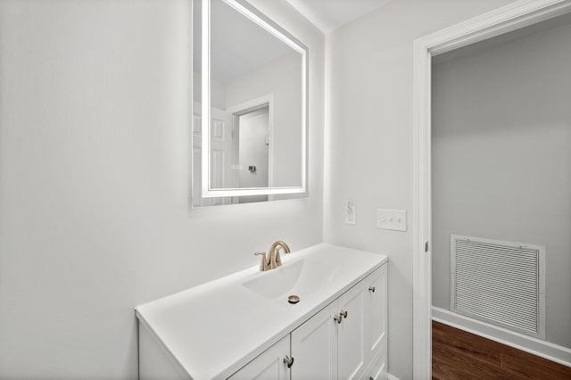 bathroom featuring vanity and wood-type flooring