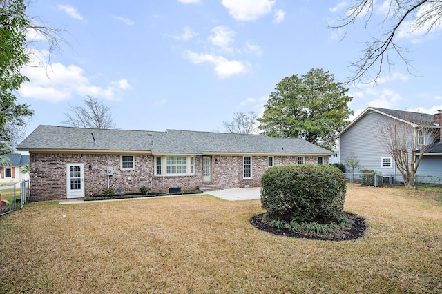 back of house featuring a patio and a lawn