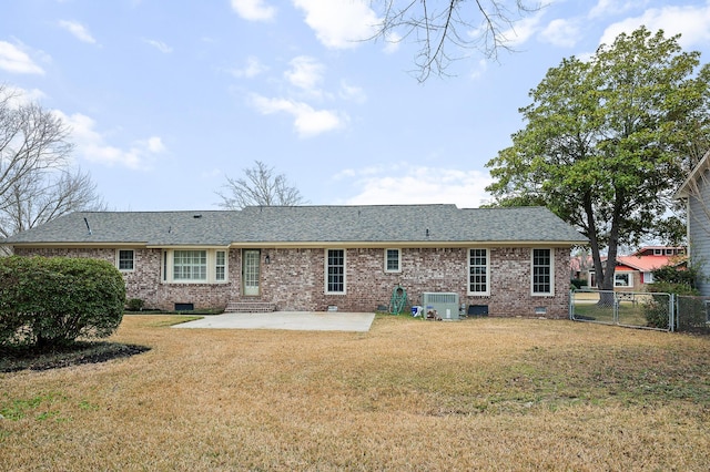 rear view of house with a yard, a patio, and central air condition unit