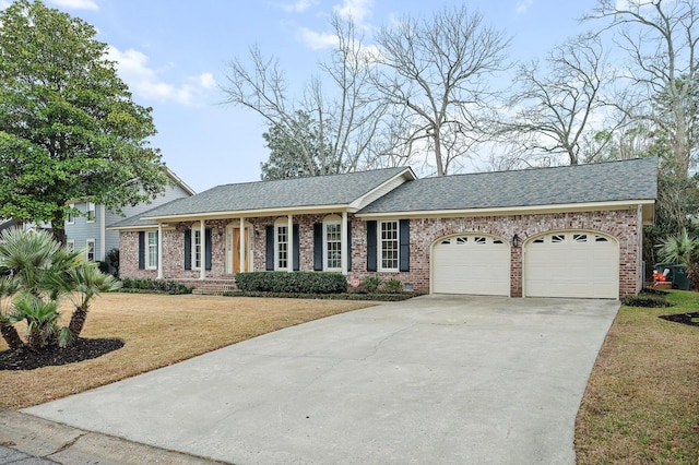 single story home with a garage and a front lawn