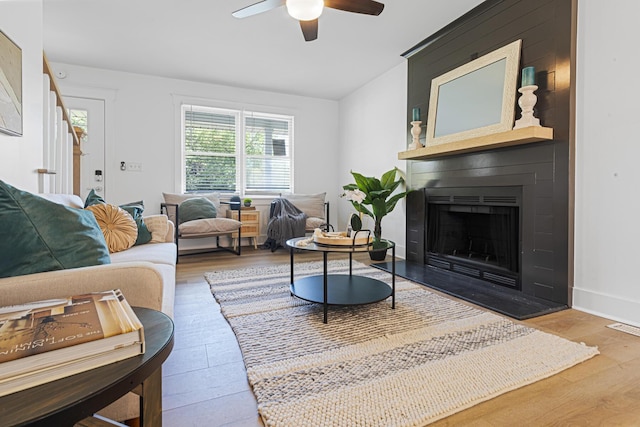 2020 Piper Dr, Charleston, SC 29407 - living room with a large fireplace, a ceiling fan, and wood finished floors