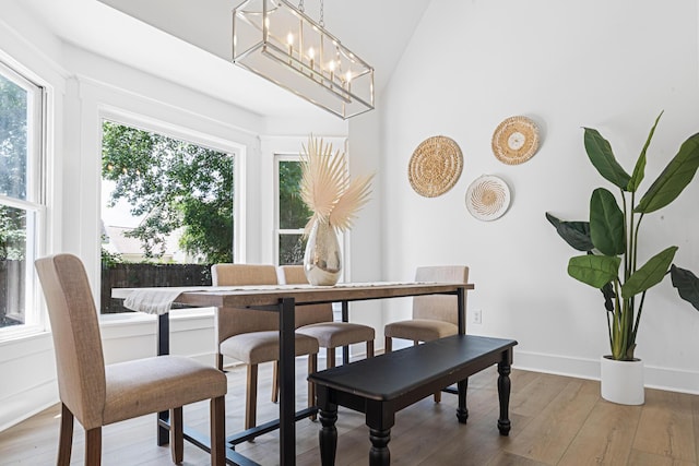 2020 Piper Dr, Charleston, SC 29407 - dining area with plenty of natural light, hardwood / wood-style flooring, lofted ceiling, and a chandelier