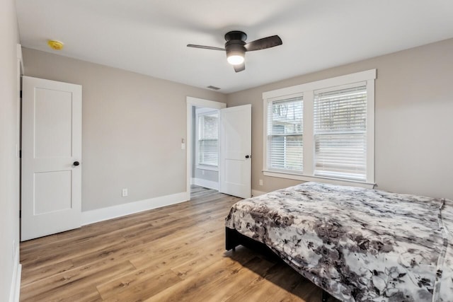 bedroom with ceiling fan and light hardwood / wood-style flooring