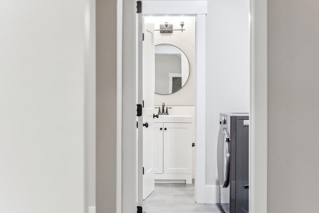 interior space with sink and washing machine and dryer