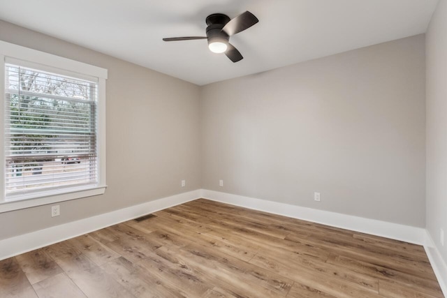 spare room featuring ceiling fan and hardwood / wood-style floors