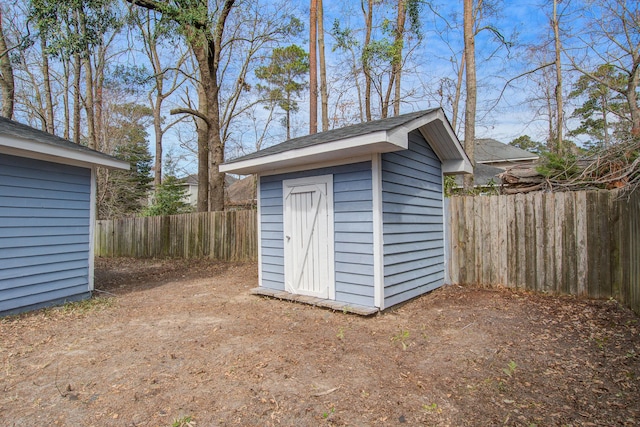 view of shed with a fenced backyard