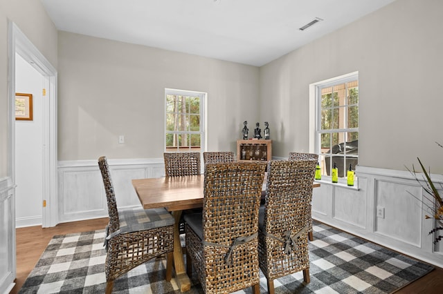 dining space featuring light hardwood / wood-style flooring and a healthy amount of sunlight