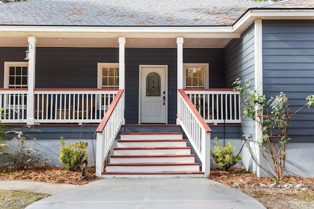 doorway to property featuring covered porch