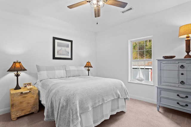 bedroom featuring ceiling fan and light colored carpet