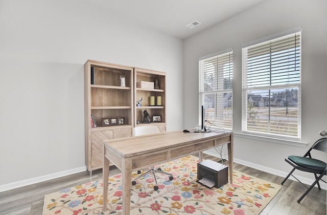 office area with hardwood / wood-style floors