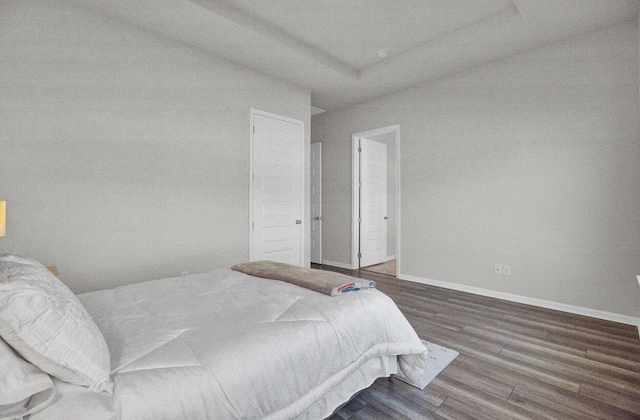 bedroom featuring dark hardwood / wood-style flooring