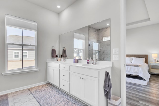 bathroom with vanity and a shower with shower door