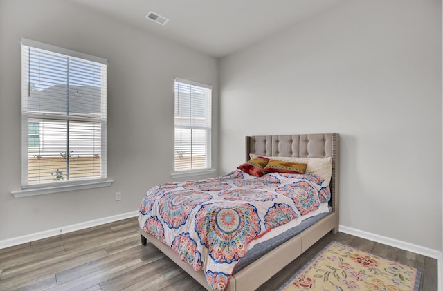 bedroom featuring wood-type flooring