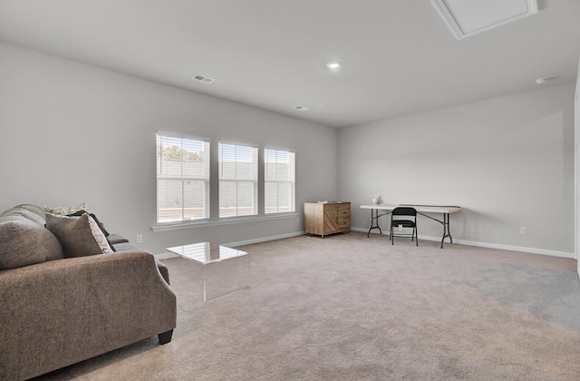 sitting room featuring light carpet