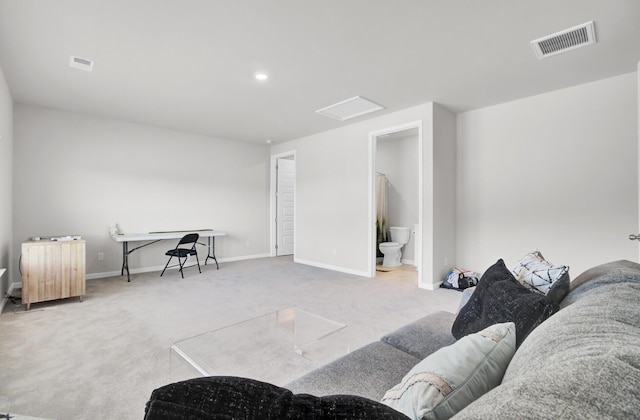 living room featuring light carpet