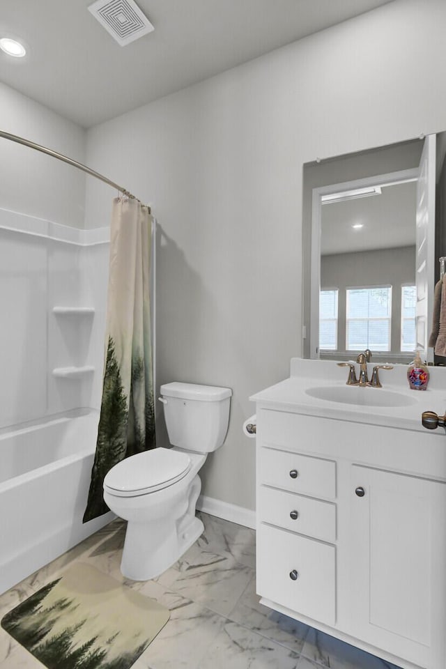 full bathroom with shower / tub combo, vanity, and toilet