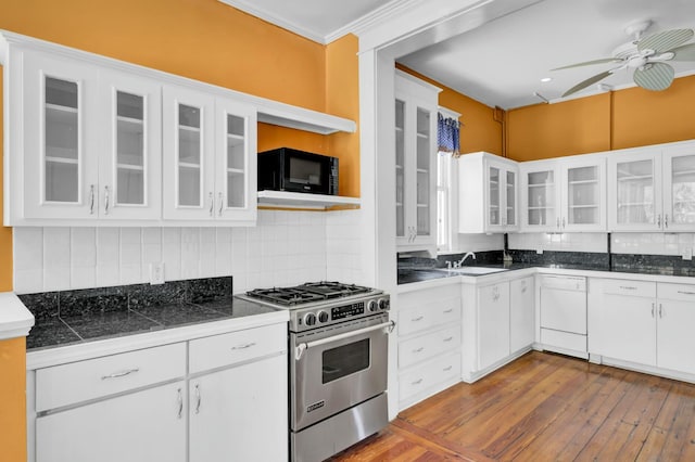 kitchen with white cabinets, dishwasher, tasteful backsplash, stainless steel gas stove, and sink