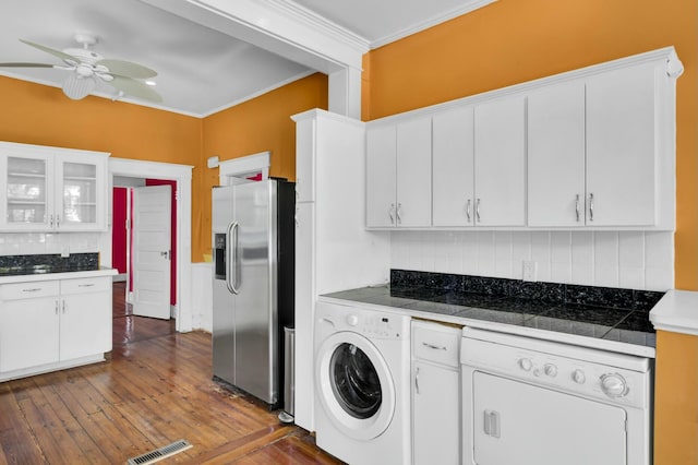 laundry area featuring ceiling fan, dark hardwood / wood-style floors, crown molding, and washer / clothes dryer