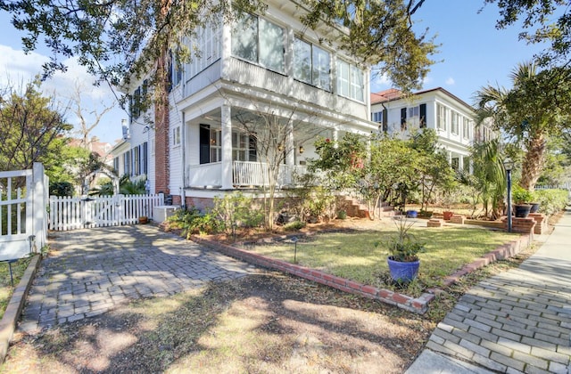 view of front of home with central air condition unit and covered porch