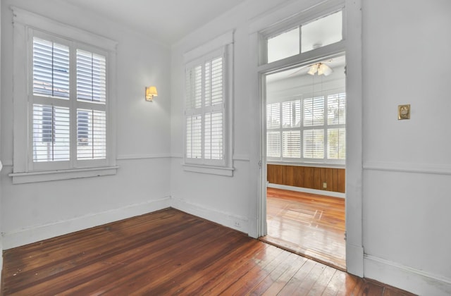 unfurnished room featuring hardwood / wood-style floors