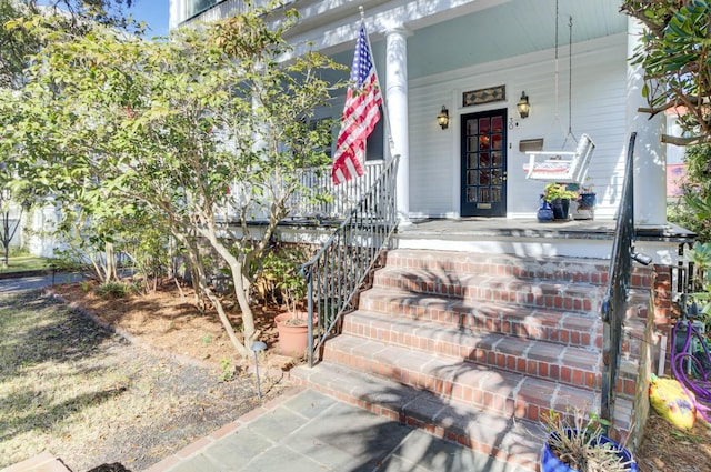 entrance to property featuring a porch