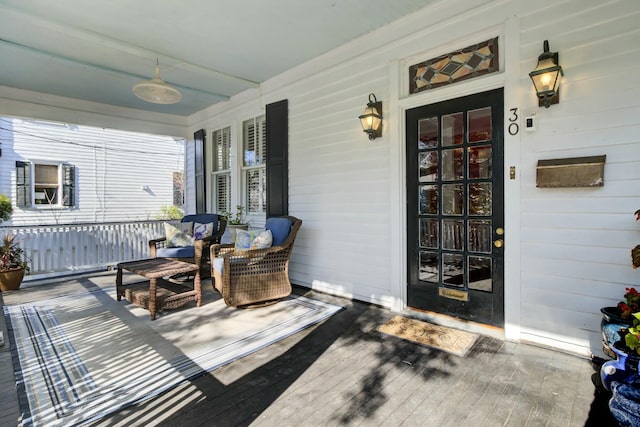 exterior space featuring covered porch and ceiling fan