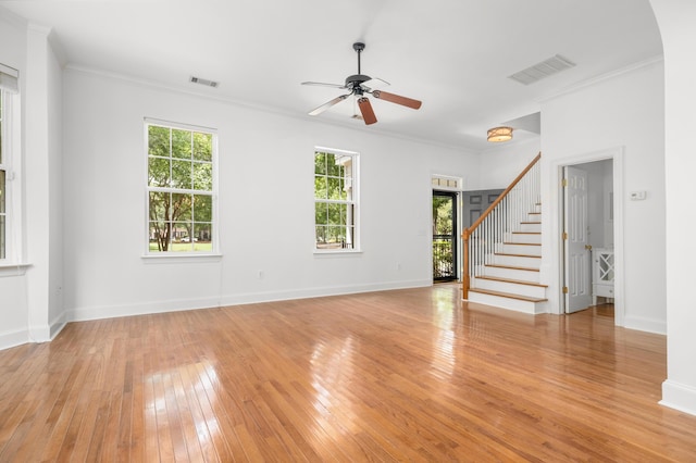 861 Center Park St, Charleston, SC 29492 - unfurnished living room featuring light wood-type flooring, ceiling fan, stairs, ornamental molding, and baseboards
