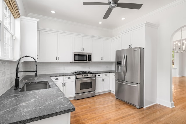 861 Center Park St, Charleston, SC 29492 - kitchen with appliances with stainless steel finishes, a sink, white cabinetry, dark stone countertops, and ceiling fan