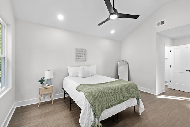 bedroom featuring ceiling fan, hardwood / wood-style floors, and vaulted ceiling