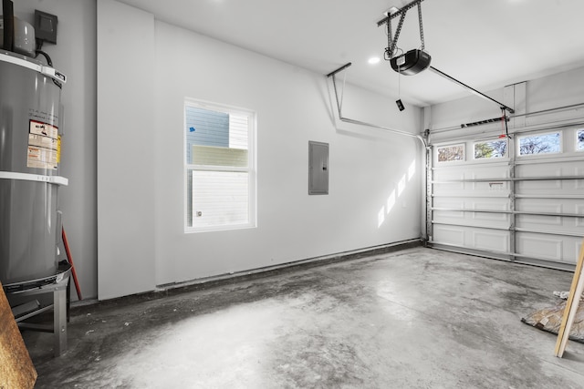 garage with secured water heater, a garage door opener, and electric panel