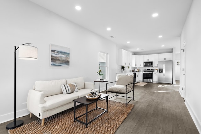 living room featuring dark hardwood / wood-style flooring