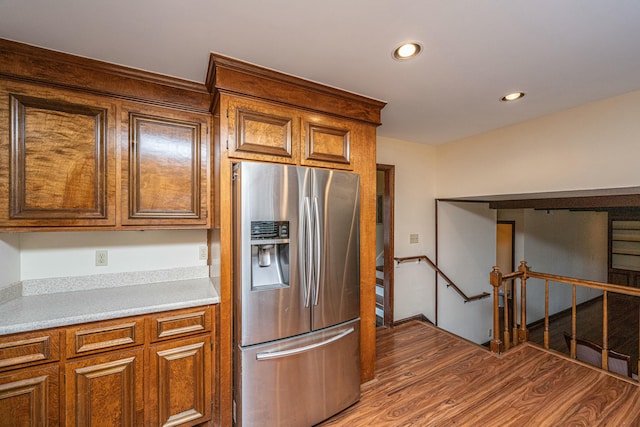 kitchen with hardwood / wood-style floors and stainless steel refrigerator with ice dispenser