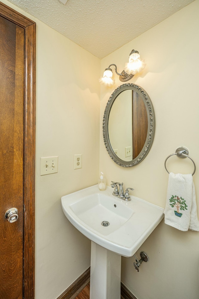 bathroom with a textured ceiling